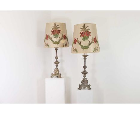 A pair of silver-plated brass altar candlestick lamps,18th or 19th century, Continental, each with scrolling repoussé decorat