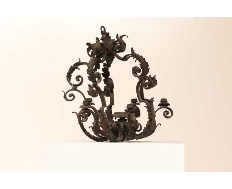 An Italianate baroque-style six-light chandelier,20th century, of leaf and scroll cast open sections, with one central sconce