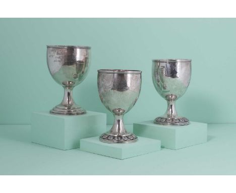 Three Georgian silver presentation stock trophies,the first by William M Traies, London 1826,inscribed 'For the Best Boar', m