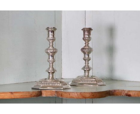 A pair of William III Britannia standard cast candlesticks,by Joseph Bird, London 1697,each engraved underneath to the rim 'I