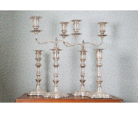 A pair of silver two-light candelabra,by Fordham &amp; Faulkner, Sheffield 1911,39cm high,together with a pair of candlestick