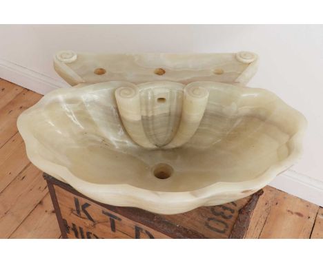 A carved onyx basin,mid-20th century, in the form of a scallop shell,64cm wide54cm deep20cm highProvenance: The Gordon Gridle