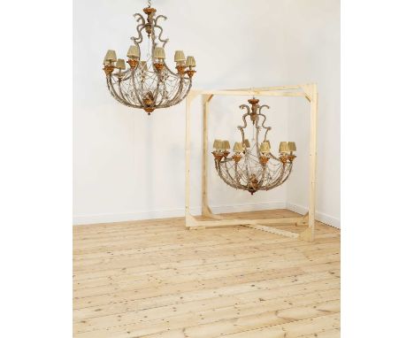 A pair of large beaded glass and giltwood ten-light chandeliers,probably early 20th century, Italian, Genoa, each with scroll