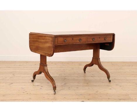 A Regency strung mahogany sofa table,the crossbanded drop-leaf top over two frieze drawers, standard end supports and downswe