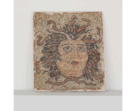 A hardstone mosaic panel,20th century, depicting the head of Medusa, 69 x 60cmComposite backed with mesh wire support. Some l