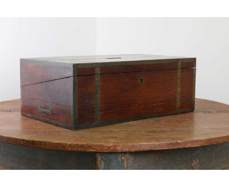 A padouk and brass-bound writing box,early 19th century, with brass strap bindings and recessed handles to either side, openi