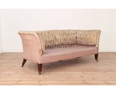 A 'Baring' model two-seater sofa by Howard & Sons,c.1890-1900, with a low scroll back and loose cushion seat, on square taper