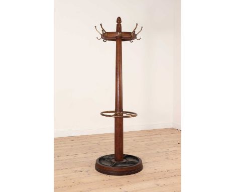 An oak and brass hat and umbrella stand,first half of the 20th century, with an acorn finial above eight double hooks, with a