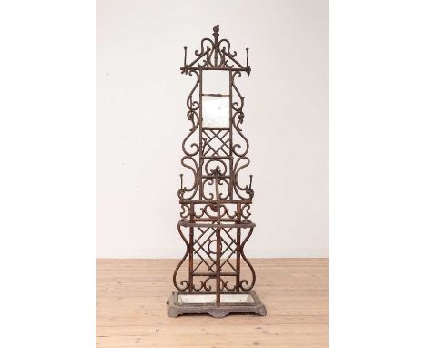 A faux bamboo cast iron hall stand,19th century, the upper section with nine hooks over the stick umbrella stand base, fitted