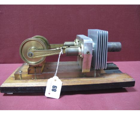 A Machined Stirling Twin Cylinder Parallel Hot Air Engine, twin flywheels 6cm in diameter, attached to wooden base, no burner