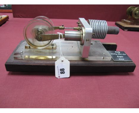 A Machined Stirling Hot Air Engine, twin perspex flywheel 7cm dia to single cylinder. attached to wooden base, no burner 30cm