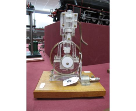 A Clear Perspex Model of a Vertical Steam Engine in the Style of Stuart, shows internal workings, metal flywheel 11cm dia, ov