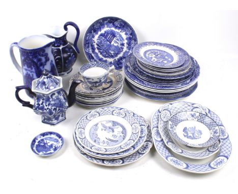 A large collection of blue and white transfer ceramics.  Including 'Old Chelsea', 'Willow' pattern, mostly plates, a teapot a