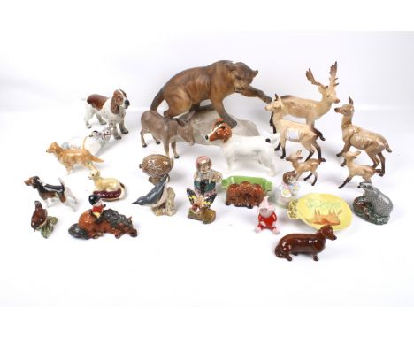 A collection of Beswick figures. Including Beatrix Potter characters, deer, a spaniel, a badger, etc. Max. H20cm