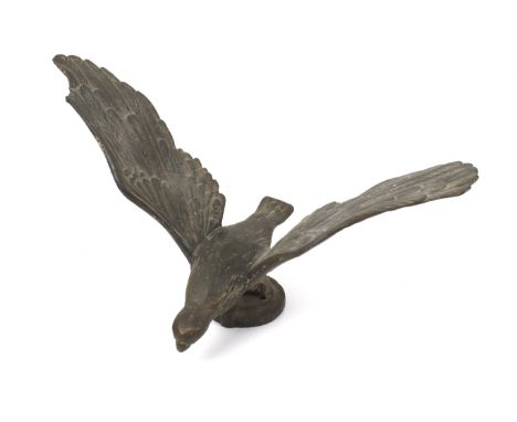 A vintage cast metal bird car hood ornament. The bird was reportedly retrieved from a church destroyed during the London Blit