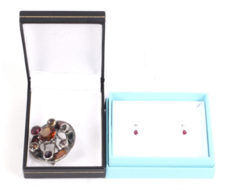 A pair of 18ct white gold, ruby and diamond earrings and a Scottish pebble brooch. The stud earrings each set with a small ro