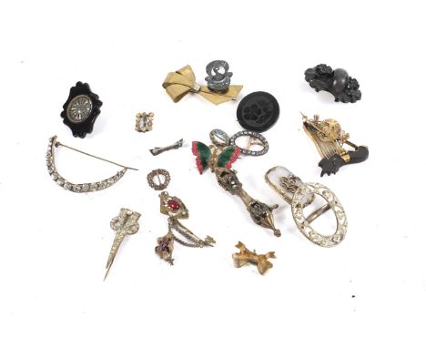 A collection of Victorian and later brooches. To include a chalcedony, garnet and half-pearl oblong brooch; an engraved jet r