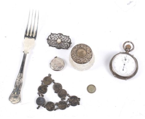 A Victorian silver cased open face keyless pocket watch and other items. Including; a 3d coin bracelet; a small 'silver' roun