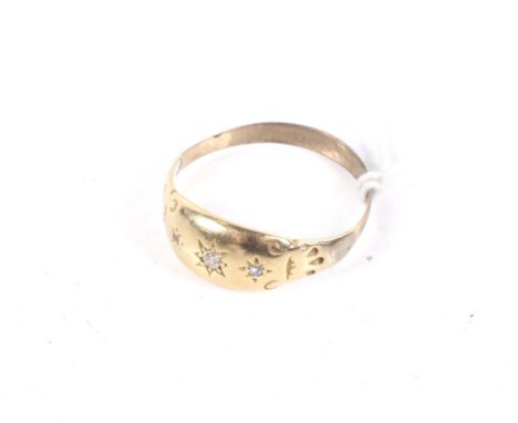 A late Victorian gold and tiny diamond three stone gypsy ring. The old-cut and rose cut stones star-gypsy set to a tapering b