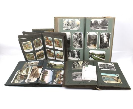 Four vintage postcard albums. Various themes including mostly topographical, comic, steamships, locomotives and religious, et
