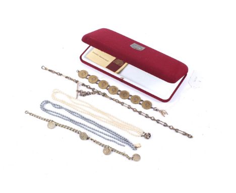 An early 20th century rose gold 'wishbone and cockerel' charm and other items. The first on a bracelet made up with pre-decim