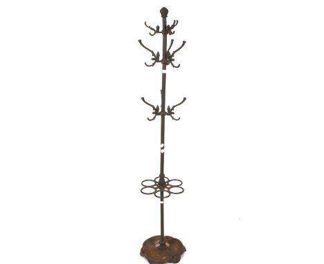 A cast metal coat and umbrella stand. With three sets of three hooks and six umbrella and stick stands, H186cm