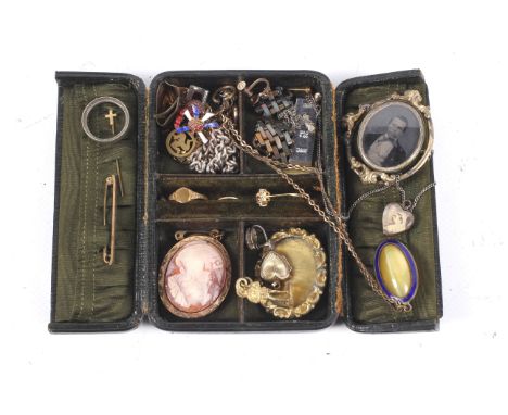 A green leather jewellery box with two doors and containing various Victorian and vintage jewellery
