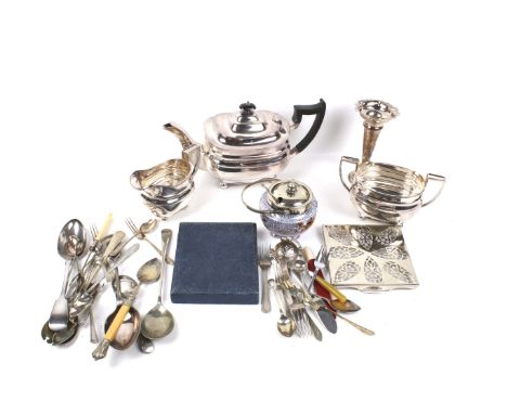 An assortment of 19th century and later silver plate. Including flatware, a trumpet vase with pierced details, a teapot, etc.