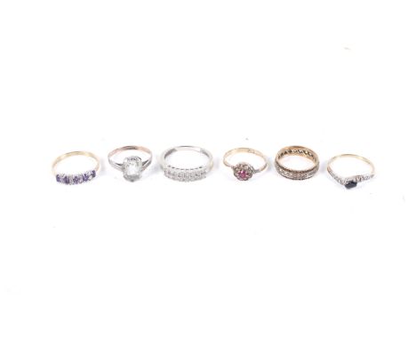 A group of six various gem set rings including four in 9ct gold. Comprising; a 9ct white gold and tiny eight-cut diamond two-