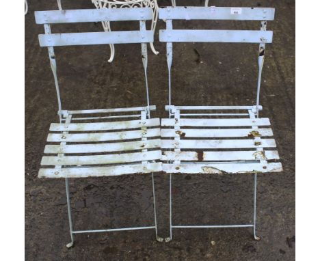 A pair of vintage folding metal garden cafe chairs. H79cm