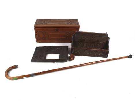 Five pieces of 20th century woodwork. Comprising a carved wooden box, L35cm, a picture frame, H26cm, a walking stick, L88cm a