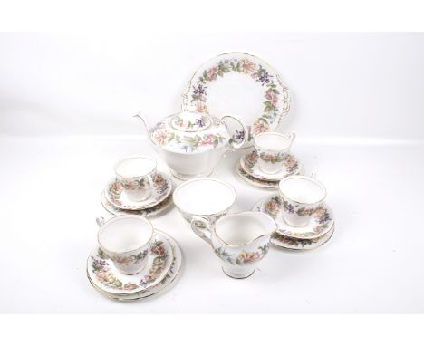 A Paragon four piece tea service in the 'Country Lane' pattern. Comprising four cups and saucers, four side plates, a jug, su