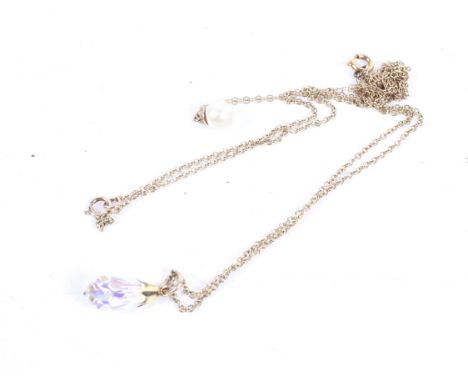 Two 9ct gold fine-link pendant necklaces. Tangled together, approx. 2.1g gross; each hung with a either cultured-pearl pendan