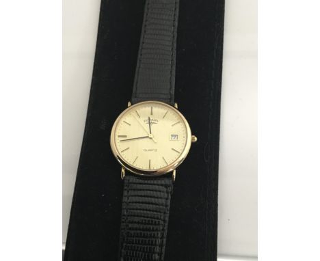 A 9ct Gold Gents Rotary watch the dial with date aperture in working order. Postage to the U.K. is £15.