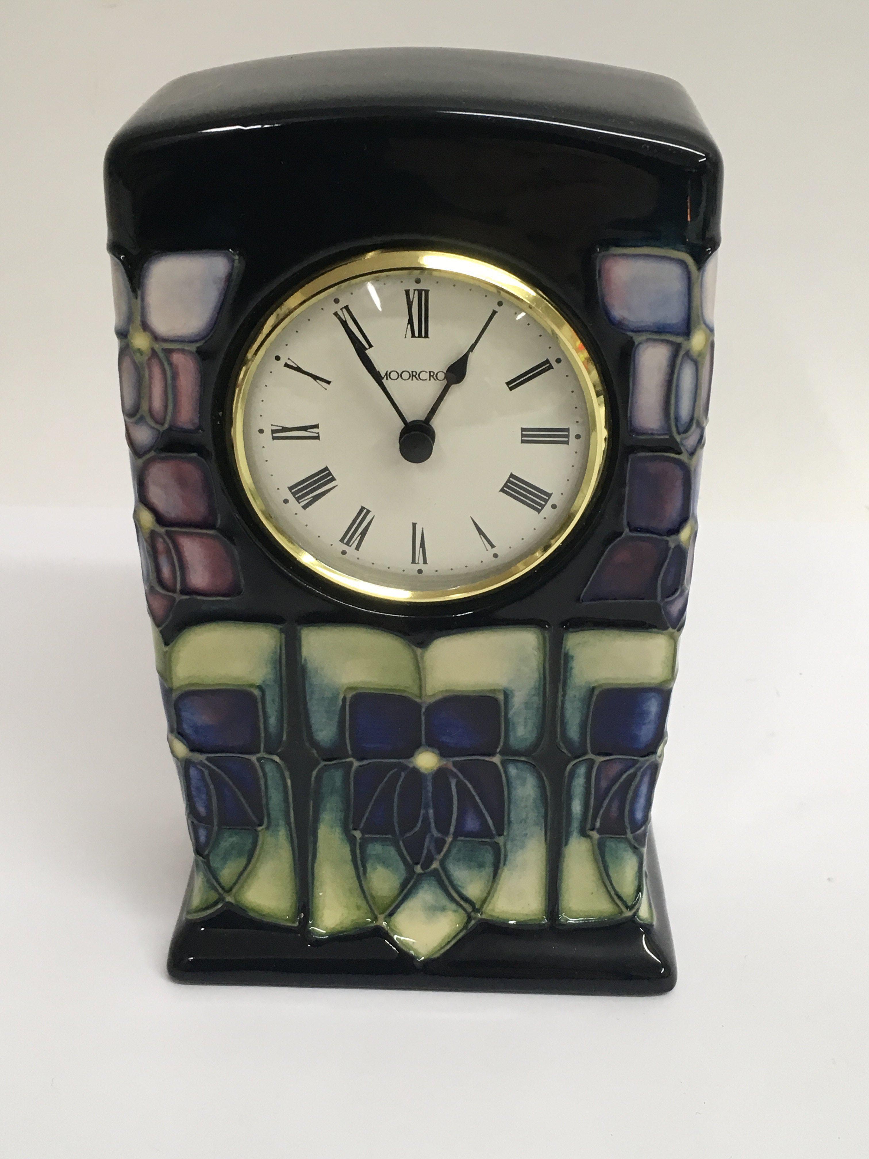 A modern Moorcroft clock decorated in the Art Nouveau style.Approx 16cm