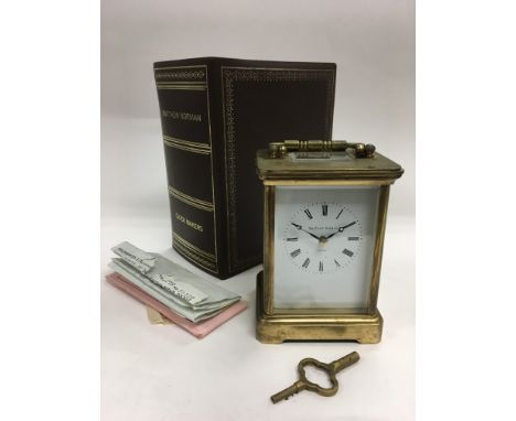 A Matthew Norman striking carriage clock with original box and paperwork.