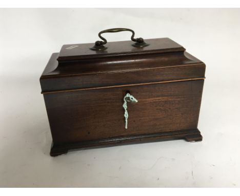 A George III mahogany tea caddy with a stepped top orgional handle the caddy with bracket feet. The interior divided in three