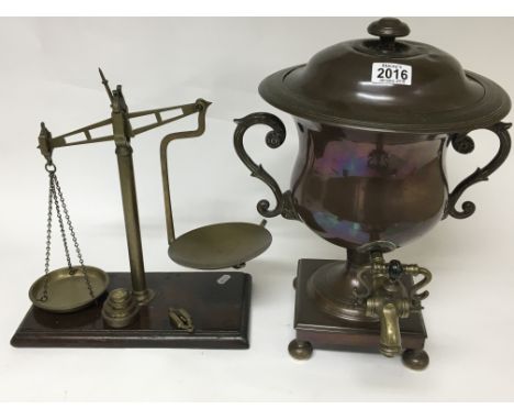 A copper and brass samavar and a set of brass beam balance scales with weights (2)