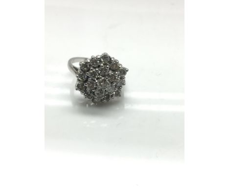 An 18ct white gold diamond cluster ring, approx 1.50ct. Size K