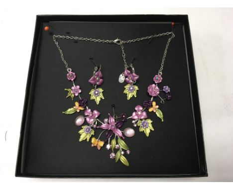 An enamel set necklace and earrings.