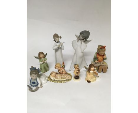 A collection of 8 China figures including Lladro and goebel