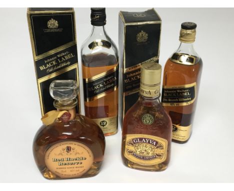 Two bottles of Johnnie Walker 12 year Extra Special Old scotch whisky, in orgional boxes (one with low level broken seal) a b