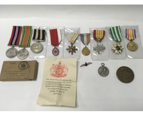 A cased set of medals including 2 boxed from WW2 and RAF badge, boxing medal etc.