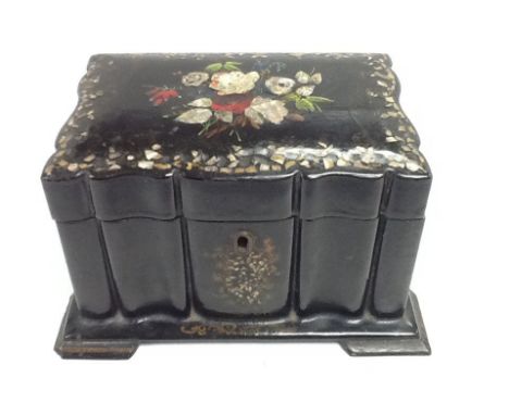 An ebonised paper mâché tea caddy. Size approx 18x13x10cm