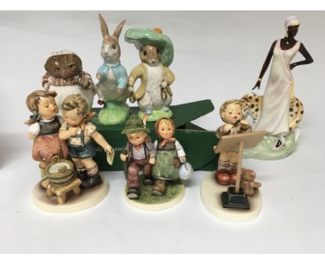 A collection of 7 figures including Doulton Beswick and goebel with limited edition boxed sammler set