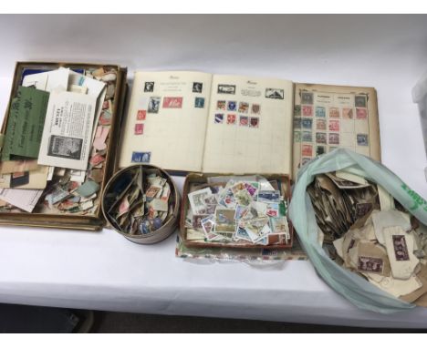 A collection of stamp albums (some unused) and loose stamps.