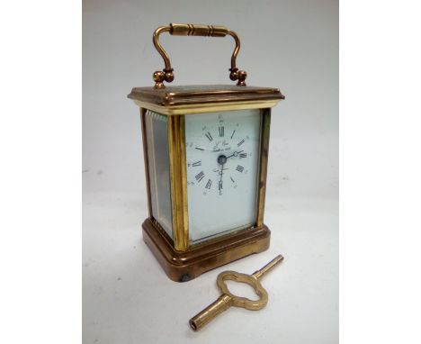 A French brass cased carriage clock.