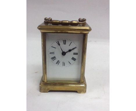 A brass carriage clock.