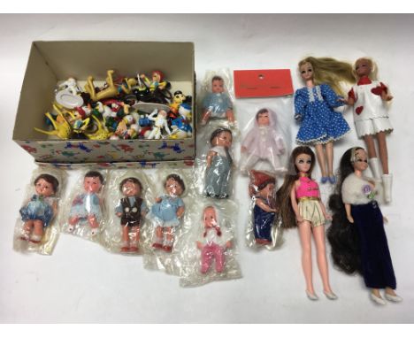 A boxed Mattel Barbie figure with a selection of other dolls including Ken with an assortment of accessories and Shell classi