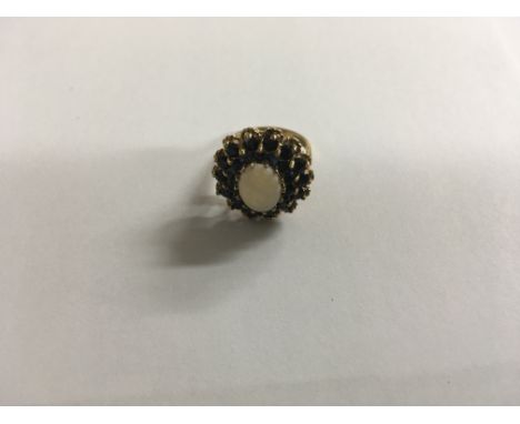 A 9ct gold large sapphire & opal cluster ring.